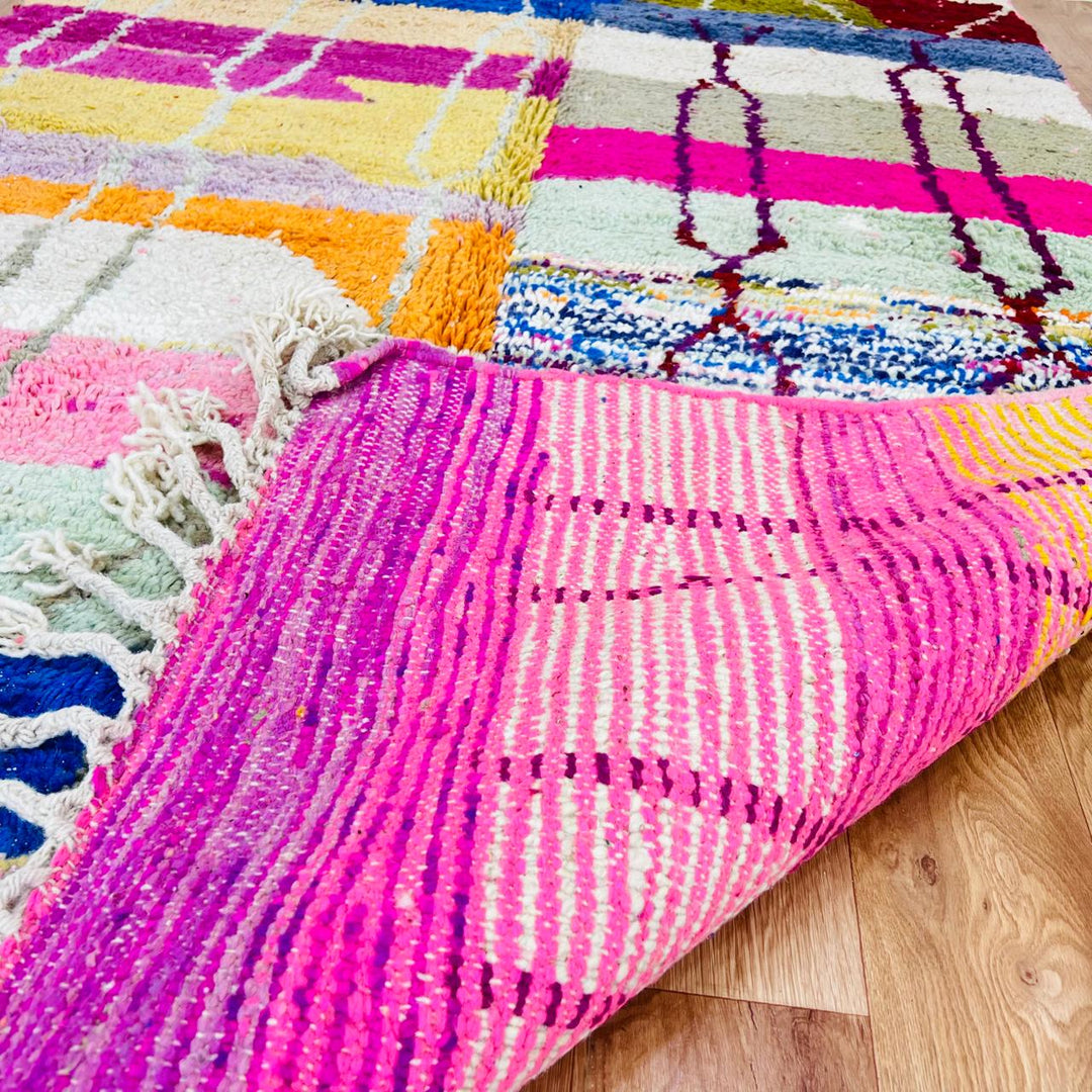 Vintage Moroccan Berber wool rug with colorful geometric patchwork pattern