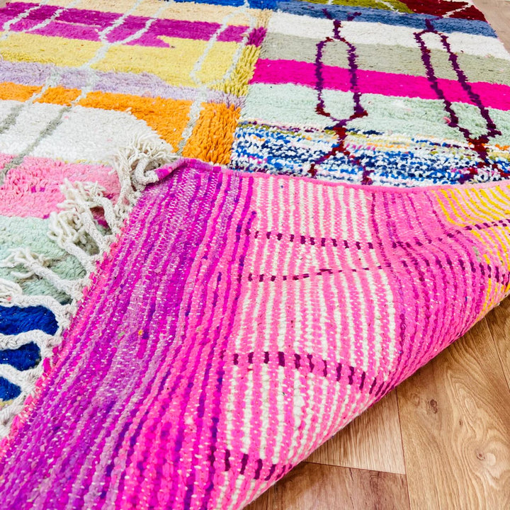 Vintage Moroccan Berber wool rug with colorful geometric patchwork pattern