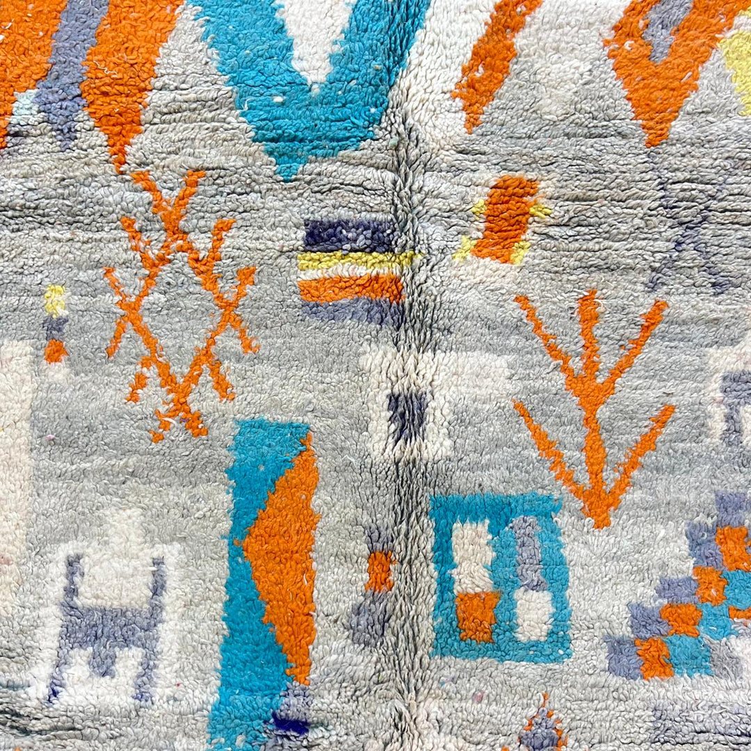 Vintage Moroccan wool rug 782 – cream and colorful handmade Berber carpet with geometric orange, turquoise, and grey patterns, 271 × 170 cm (8.89 × 5.57 ft).