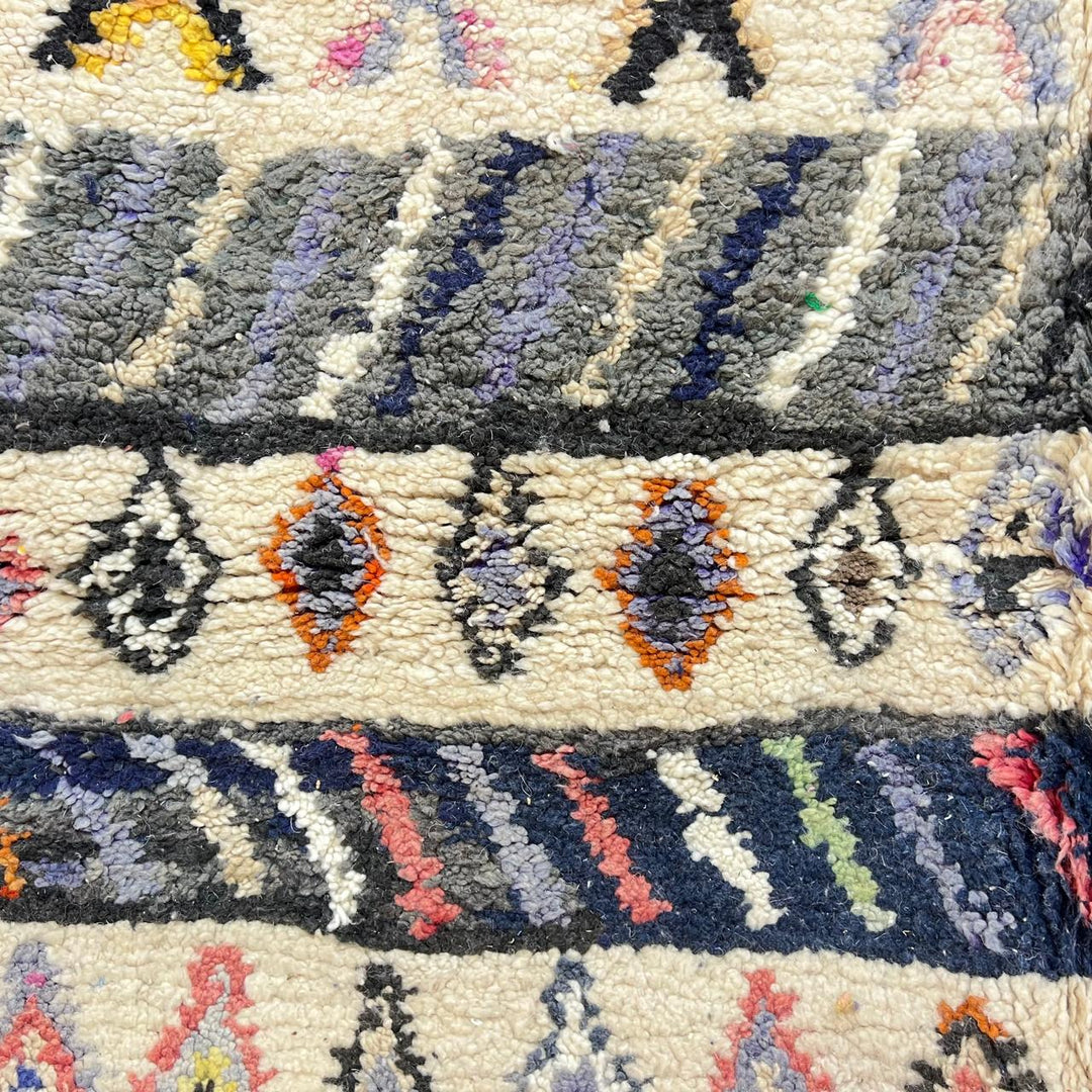 Vintage Moroccan wool rug 259 – handmade tribal diamond pattern in cream, charcoal, and color accents (253 × 160 cm).