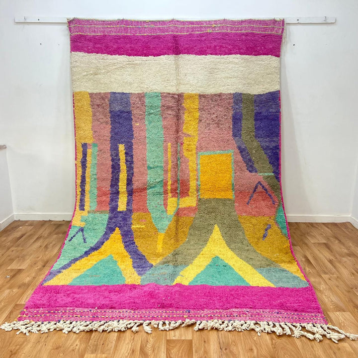 Vintage Moroccan wool rug 843 – handwoven Berber carpet with colorful pink, yellow, green and purple geometric design (316 × 198 cm).