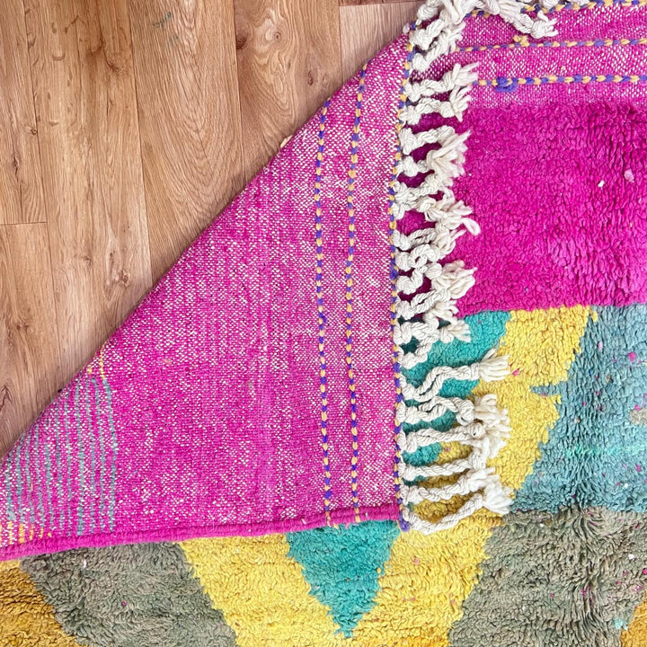 Vintage Moroccan wool rug 843 – handwoven Berber carpet with colorful pink, yellow, green and purple geometric design (316 × 198 cm).