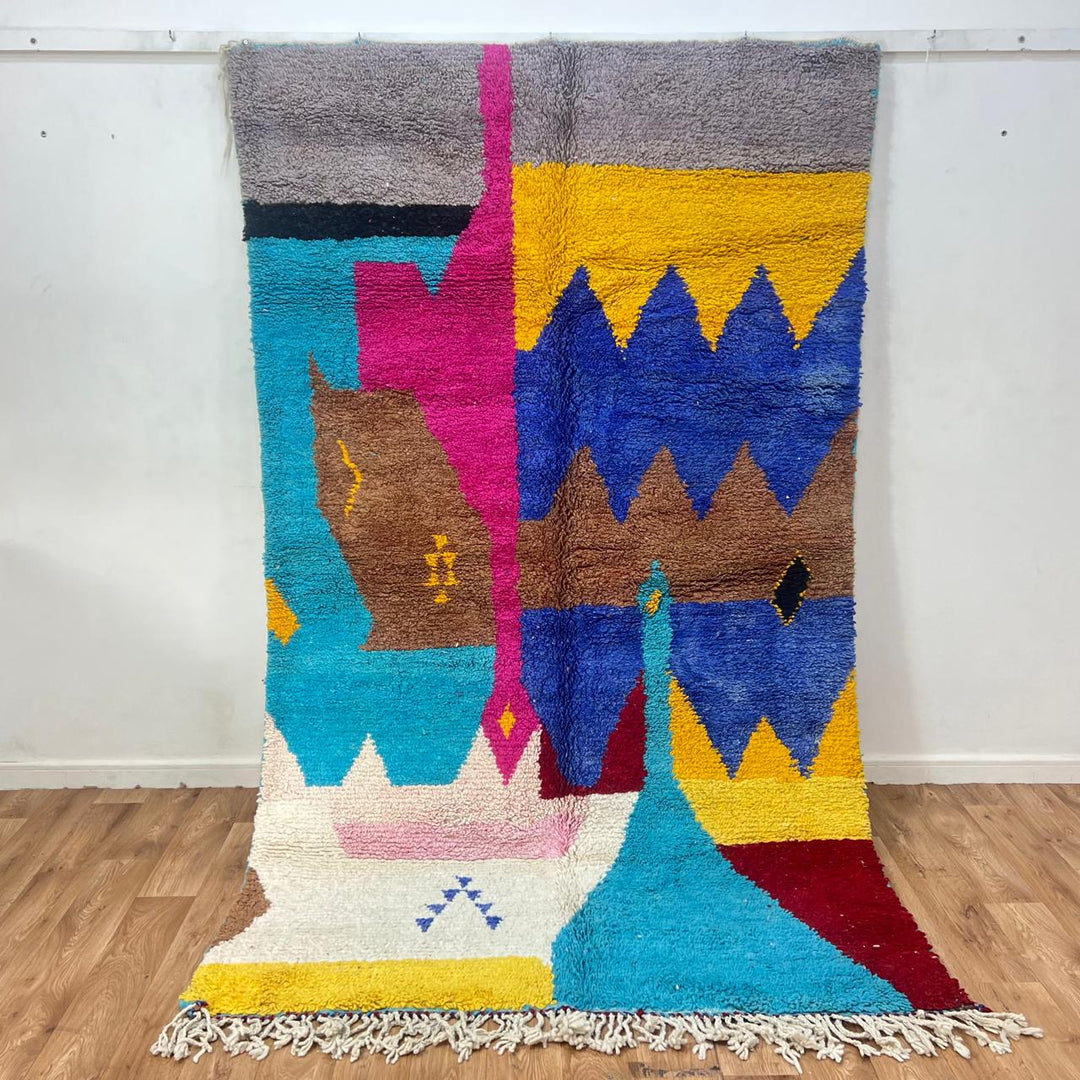 Vintage Moroccan wool rug 252 – handmade Berber carpet with colorful abstract design in blue, yellow and pink tones (259 × 157 cm).