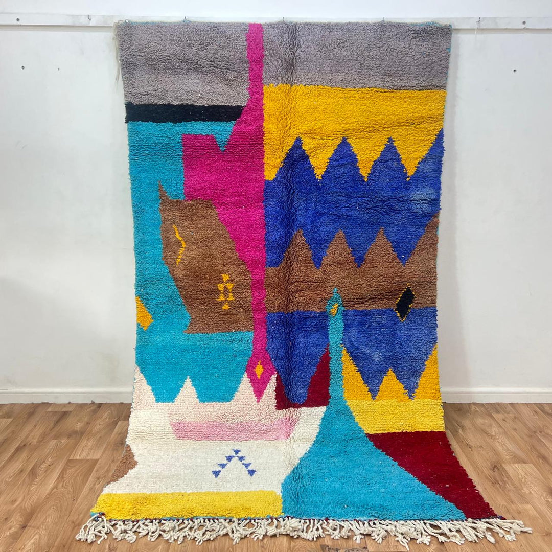Vintage Moroccan wool rug 252 – handmade Berber carpet with colorful abstract design in blue, yellow and pink tones (259 × 157 cm).