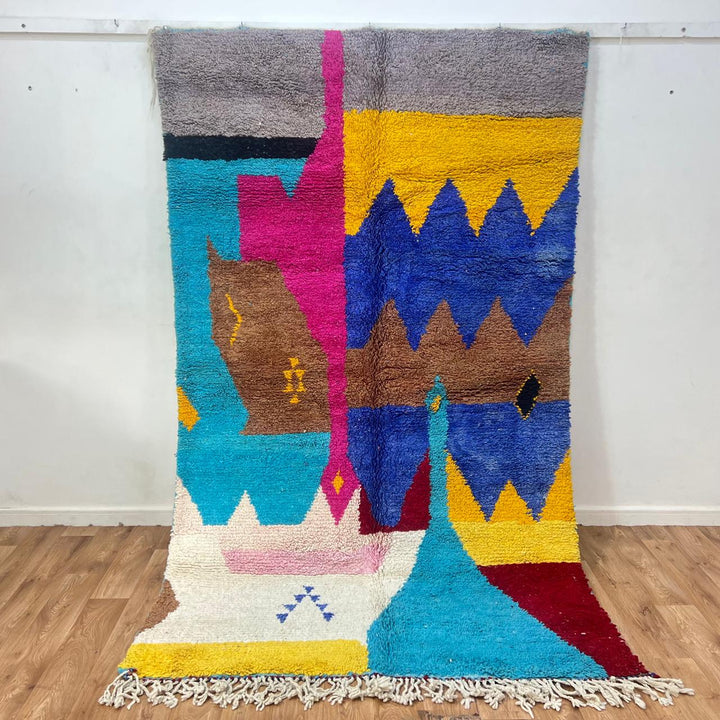 Vintage Moroccan wool rug 252 – handmade Berber carpet with colorful abstract design in blue, yellow and pink tones (259 × 157 cm).