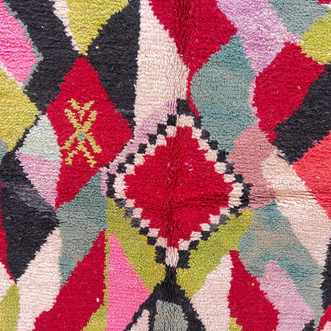 Vintage Moroccan wool rug 210 – handmade colorful geometric Berber design in red, green, pink, and cream (282 × 158 cm).
