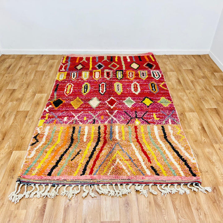 Vintage Moroccan wool rug with red base, colorful Berber diamond patterns, handmade tribal carpet