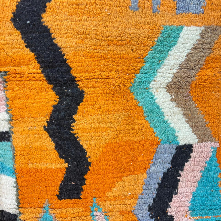 Vintage Moroccan wool rug 324 – handmade Berber carpet with bright orange base and multicolor geometric tribal design, 260 × 190 cm (8.53 × 6.23 ft).