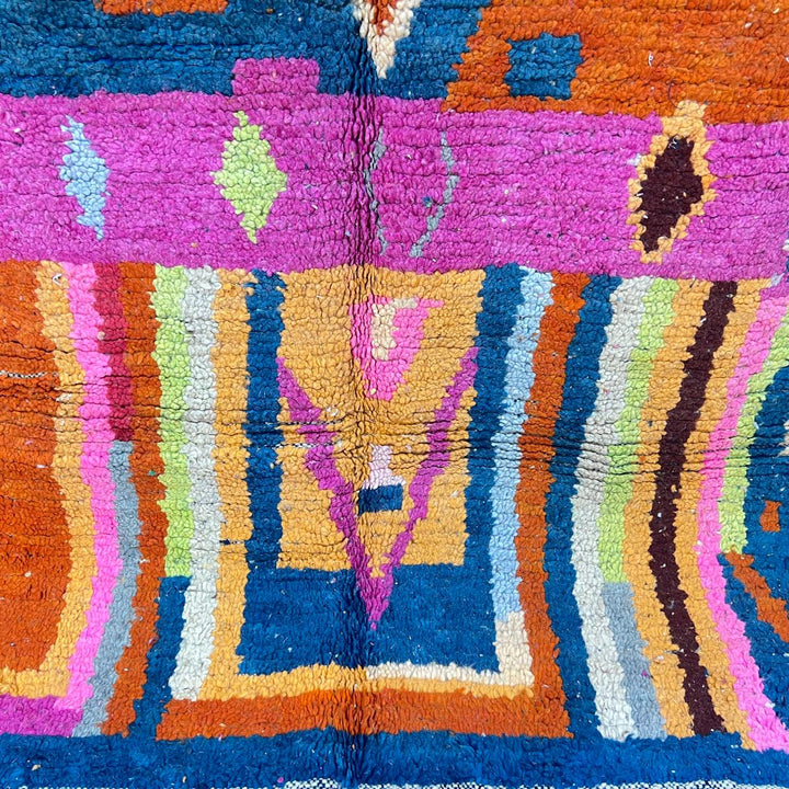 Vintage Moroccan wool rug 138 – handmade colorful geometric Berber design with pink, blue, and orange tones (234 × 162 cm).