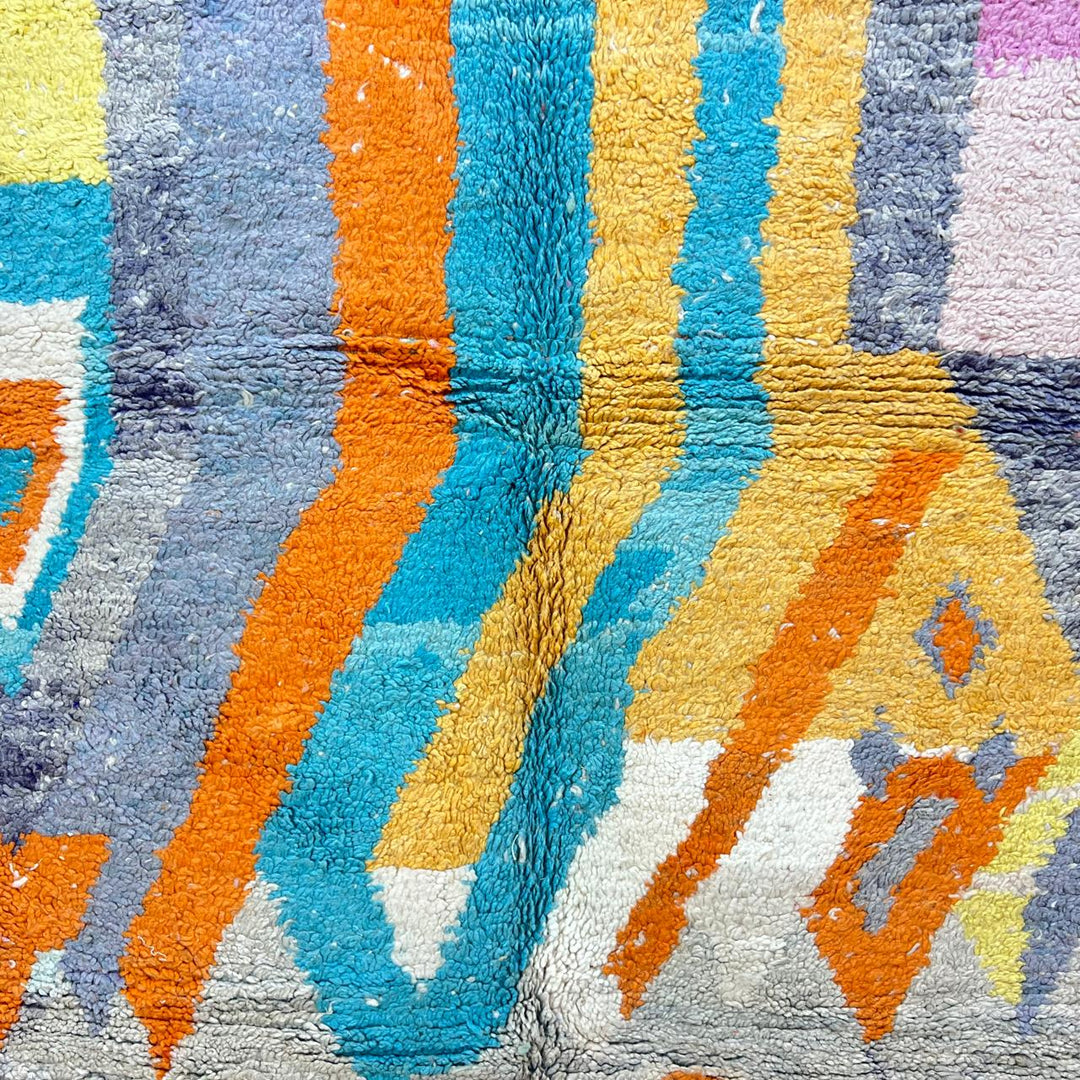 Vintage Moroccan wool rug 782 – cream and colorful handmade Berber carpet with geometric orange, turquoise, and grey patterns, 271 × 170 cm (8.89 × 5.57 ft).