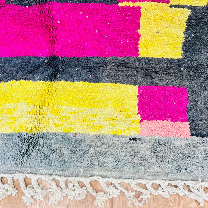 Vintage Moroccan wool rug with pink yellow and charcoal geometric pattern, handwoven Berber carpet from Morocco