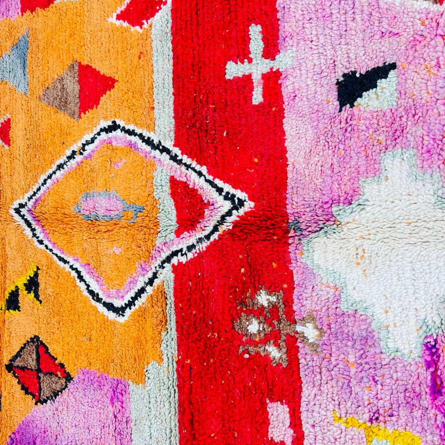 Vintage Moroccan rug handmade from colorful Berber wool with geometric tribal design