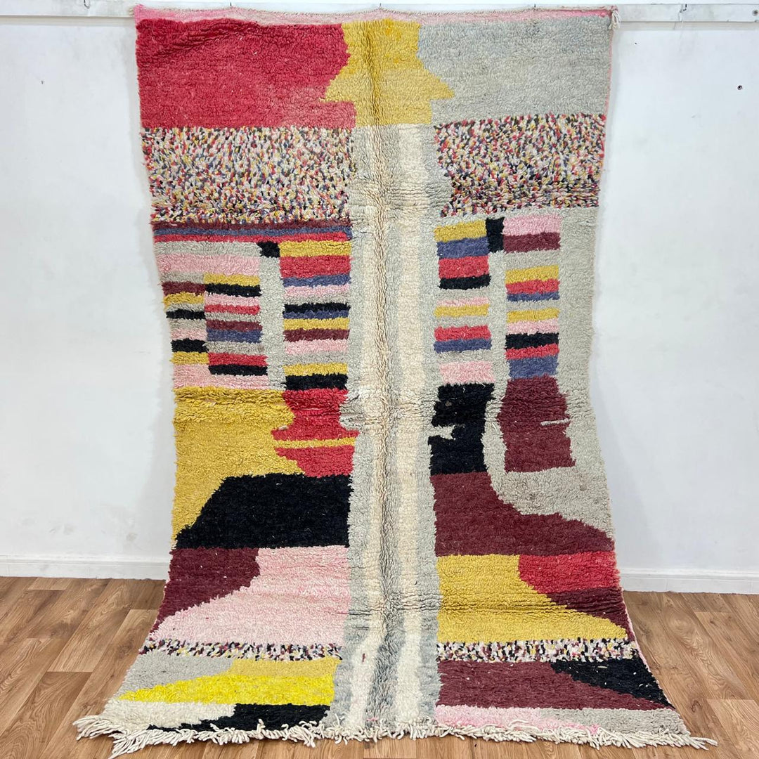 Vintage Moroccan wool rug with colorful abstract Berber pattern in mustard, pink, burgundy and ivory tones, handwoven in Morocco