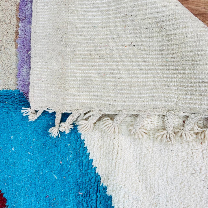 Vintage Moroccan Berber wool rug with abstract color block design in red, orange, blue and cream, handmade in Morocco, 263x172 cm