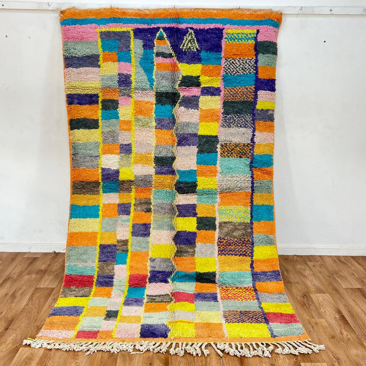 Vintage Moroccan wool rug with colorful geometric mosaic Berber pattern in mustard, orange, teal, pink and blue, handwoven in Morocco