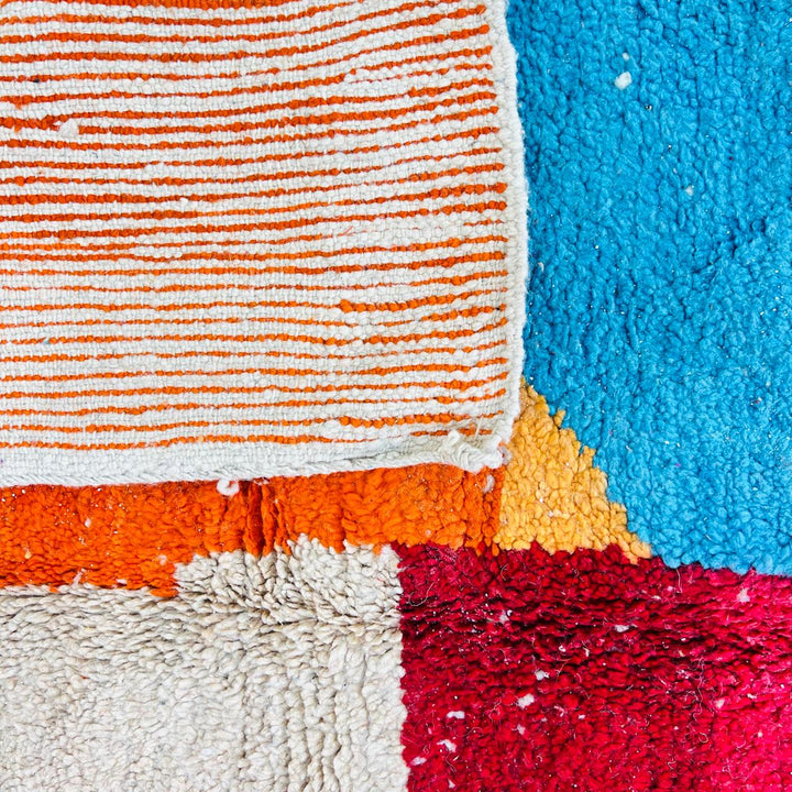 Vintage Moroccan Berber wool rug with abstract color block design in red, orange, blue and cream, handmade in Morocco, 263x172 cm