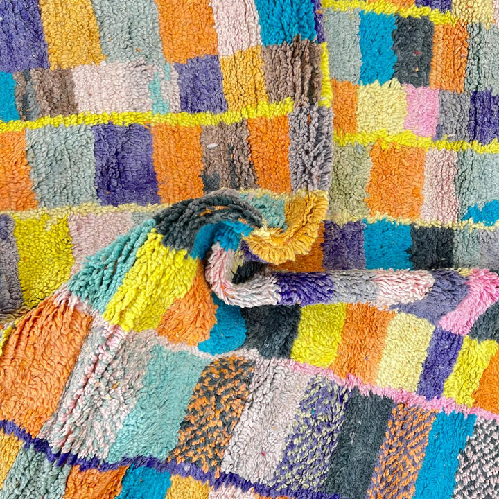 Vintage Moroccan wool rug with colorful geometric mosaic Berber pattern in mustard, orange, teal, pink and blue, handwoven in Morocco