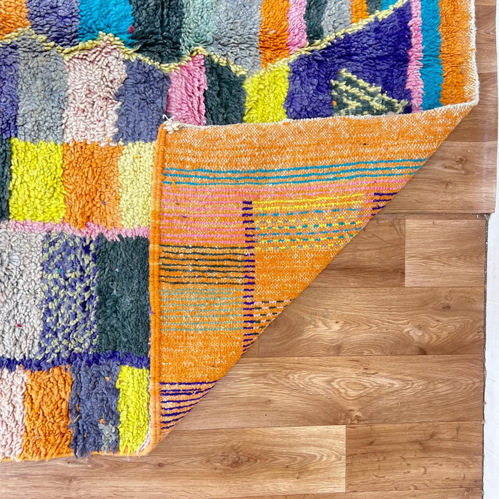 Vintage Moroccan wool rug with colorful geometric mosaic Berber pattern in mustard, orange, teal, pink and blue, handwoven in Morocco