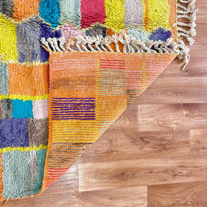 Vintage Moroccan wool rug with colorful geometric mosaic Berber pattern in mustard, orange, teal, pink and blue, handwoven in Morocco