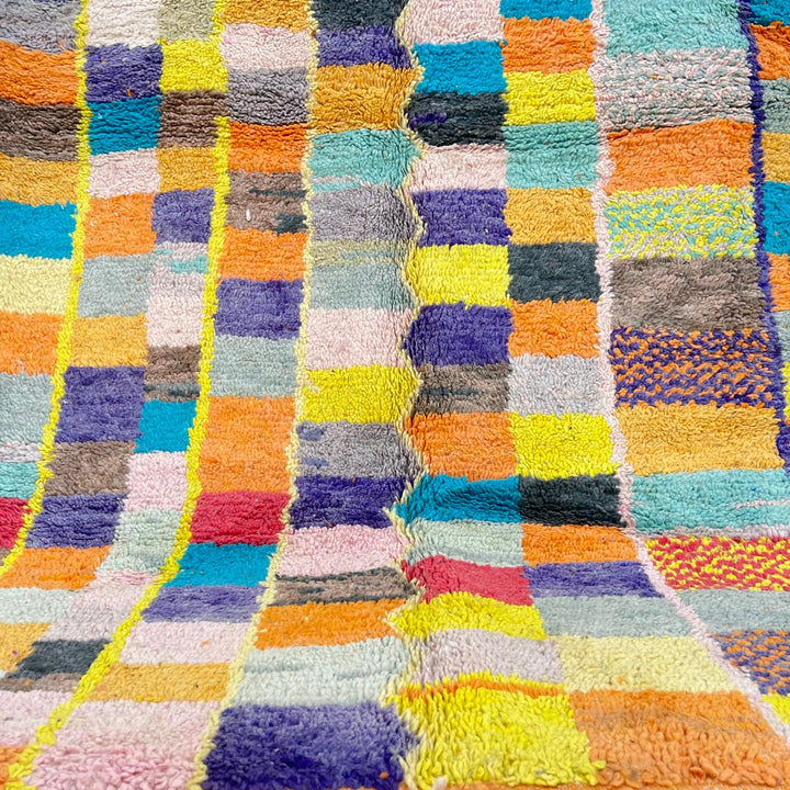 Vintage Moroccan wool rug with colorful geometric mosaic Berber pattern in mustard, orange, teal, pink and blue, handwoven in Morocco