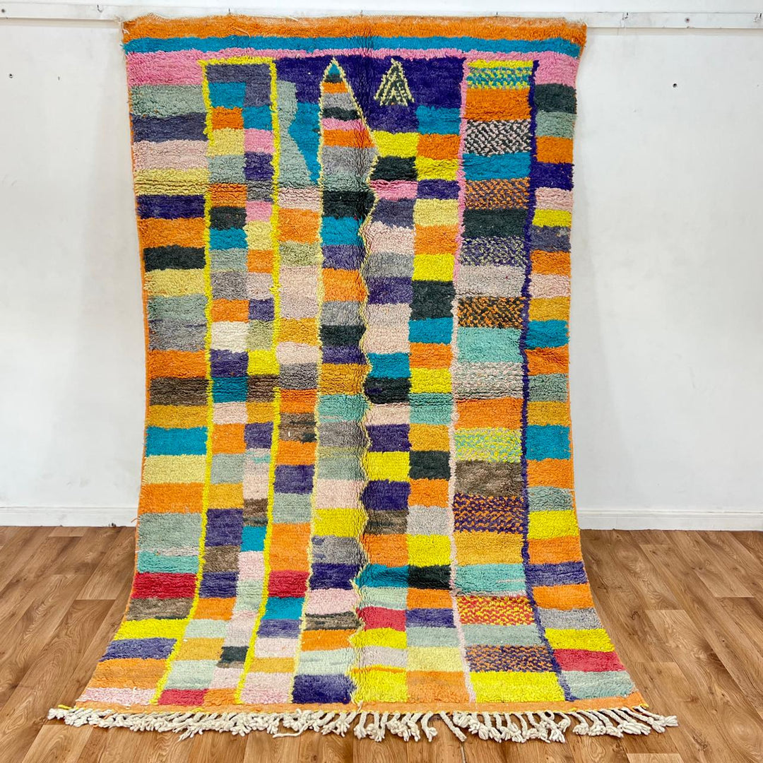 Vintage Moroccan wool rug with colorful geometric mosaic Berber pattern in mustard, orange, teal, pink and blue, handwoven in Morocco