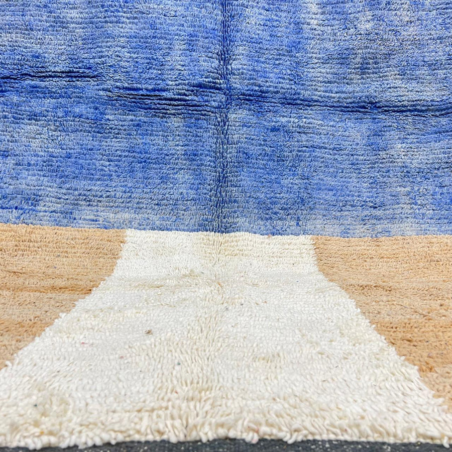 Vintage Moroccan wool rug with blue and beige color-block minimalist Berber design, handwoven in Morocco