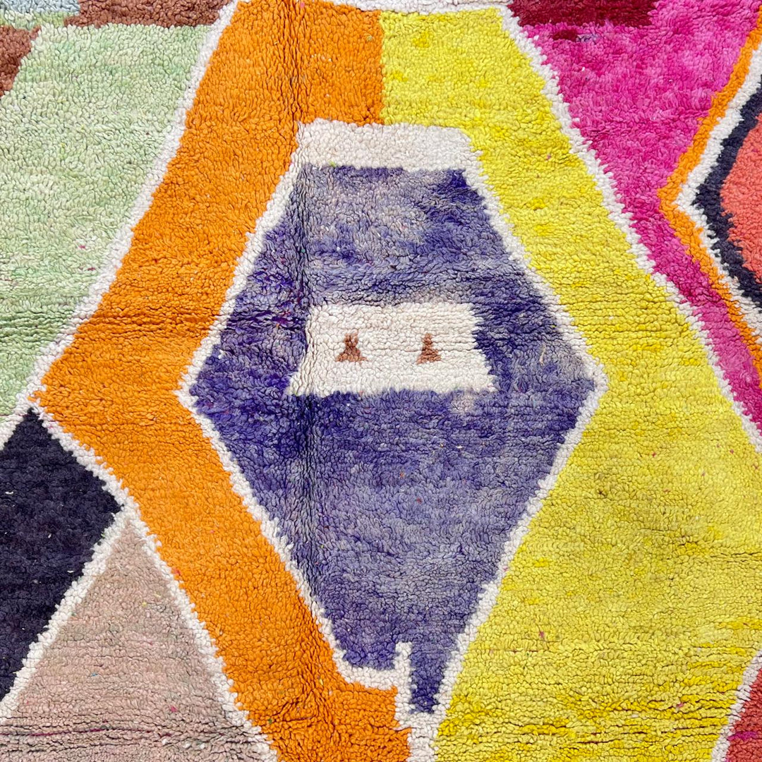 Vintage Moroccan wool rug with bold abstract geometric Berber design in yellow, orange, charcoal and neutral tones, handwoven in Morocco