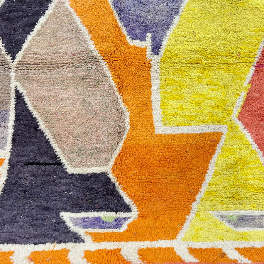 Vintage Moroccan wool rug with bold abstract geometric Berber design in yellow, orange, charcoal and neutral tones, handwoven in Morocco
