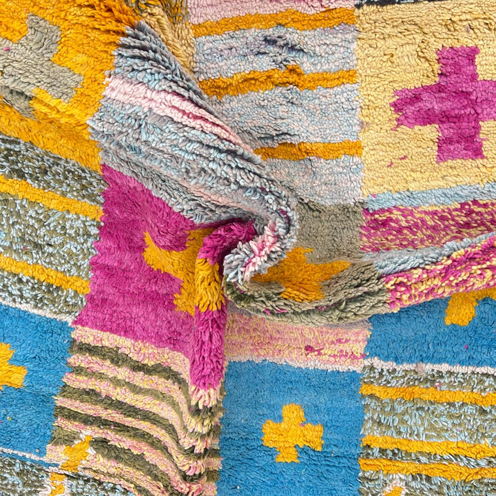 Vintage Moroccan wool rug with colorful Berber cross pattern in teal, yellow, pink and ivory, handwoven in Morocco