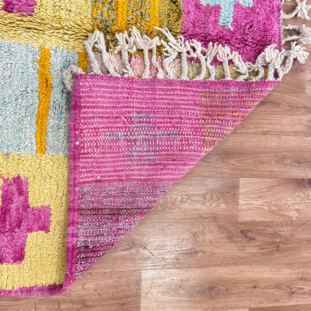 Vintage Moroccan wool rug with colorful Berber cross pattern in teal, yellow, pink and ivory, handwoven in Morocco