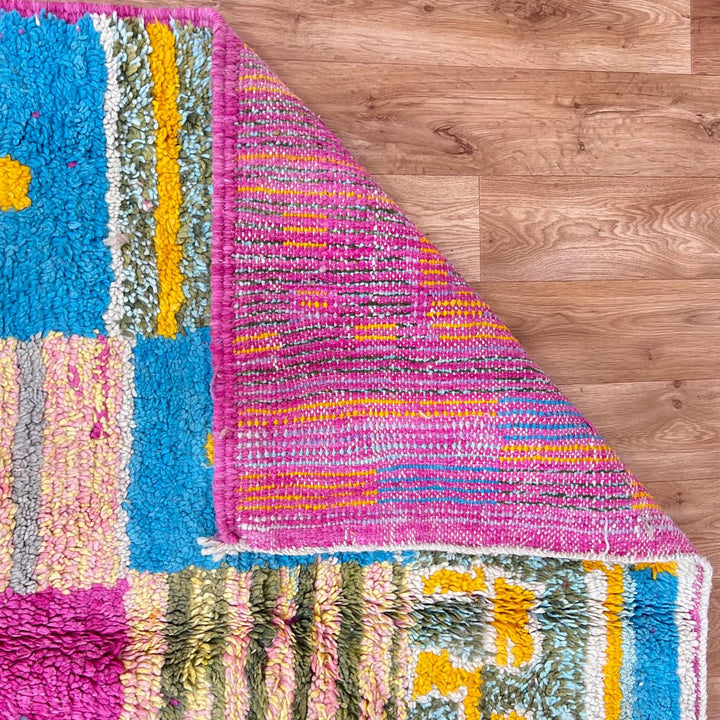 Vintage Moroccan wool rug with colorful Berber cross pattern in teal, yellow, pink and ivory, handwoven in Morocco