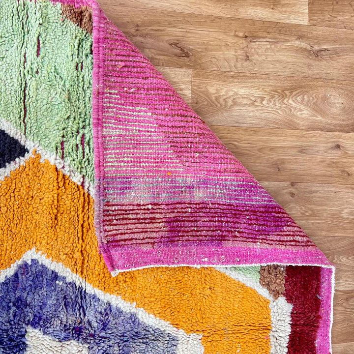Vintage Moroccan wool rug with bold abstract geometric Berber design in yellow, orange, charcoal and neutral tones, handwoven in Morocco