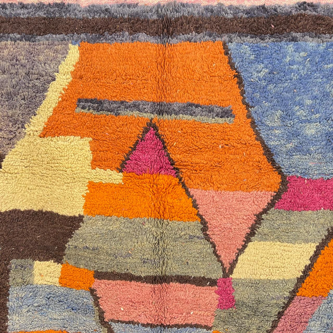 Vintage Moroccan wool rug with abstract geometric Berber design in orange, pink, blue and gray tones, handwoven in Morocco.