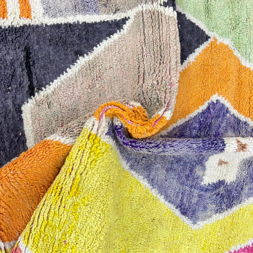 Vintage Moroccan wool rug with bold abstract geometric Berber design in yellow, orange, charcoal and neutral tones, handwoven in Morocco