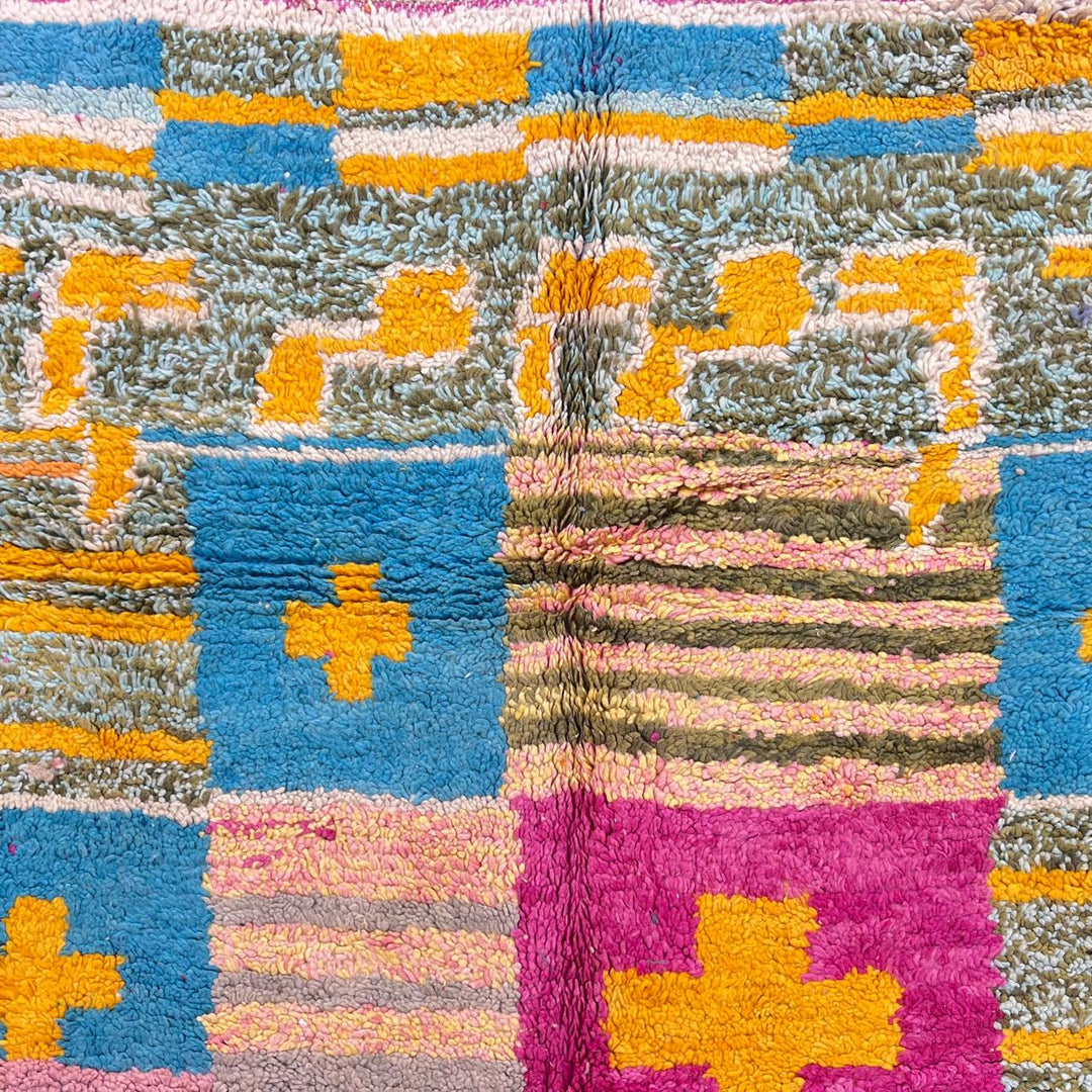 Vintage Moroccan wool rug with colorful Berber cross pattern in teal, yellow, pink and ivory, handwoven in Morocco