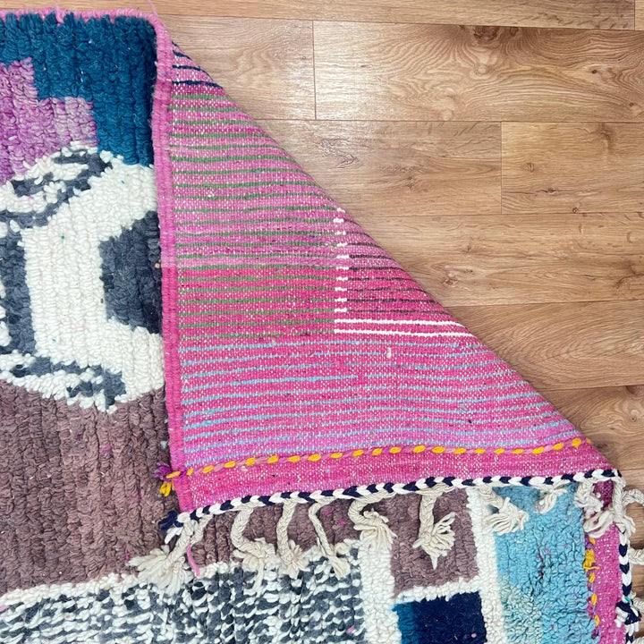 Vintage Moroccan wool rug with abstract Berber geometric motifs in mustard yellow, blue, lilac and ivory, handwoven in Morocco