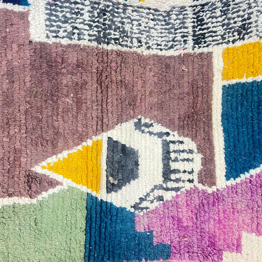 Vintage Moroccan wool rug with abstract Berber geometric motifs in mustard yellow, blue, lilac and ivory, handwoven in Morocco