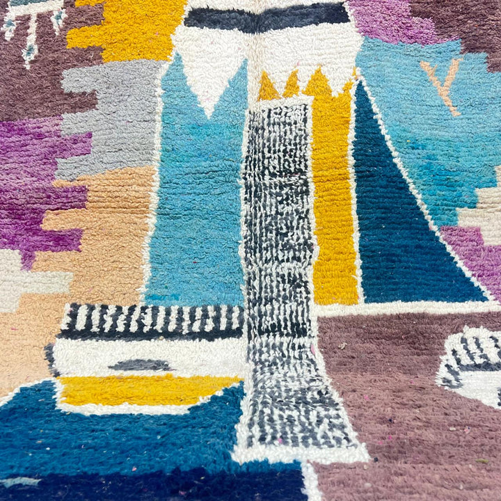 Vintage Moroccan wool rug with abstract Berber geometric motifs in mustard yellow, blue, lilac and ivory, handwoven in Morocco