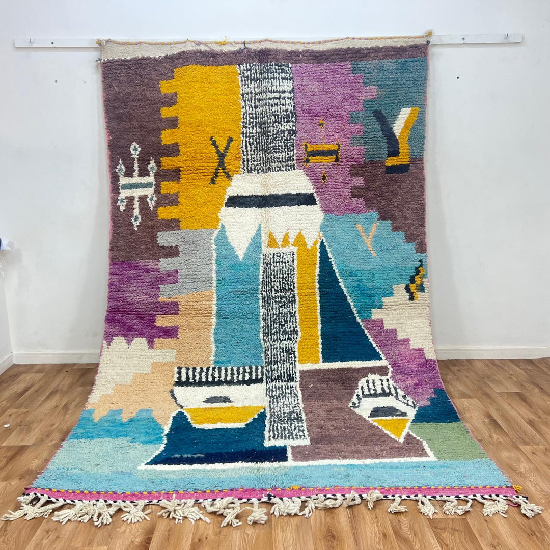 Vintage Moroccan wool rug with abstract Berber geometric motifs in mustard yellow, blue, lilac and ivory, handwoven in Morocco