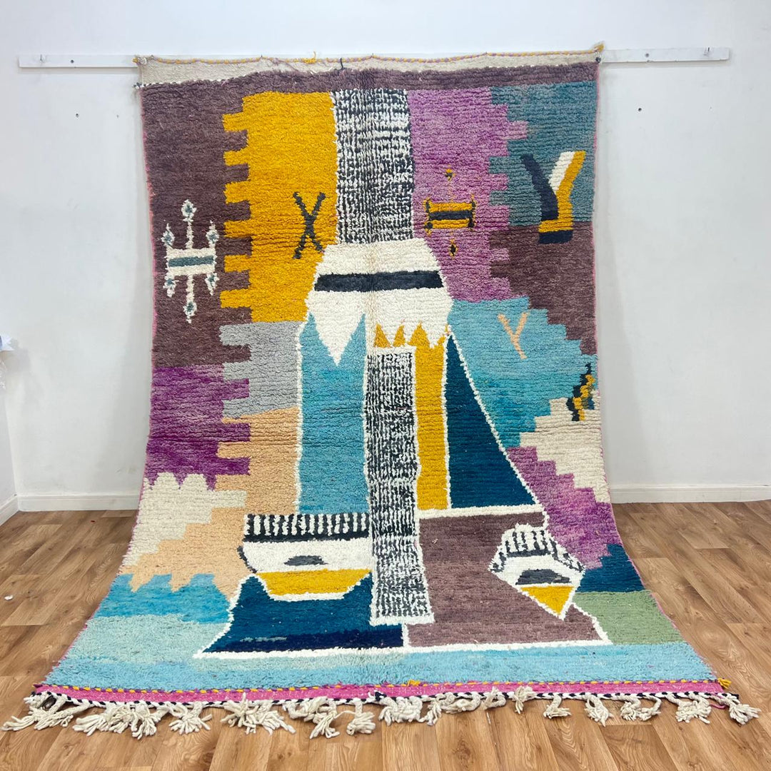 Vintage Moroccan wool rug with abstract Berber geometric motifs in mustard yellow, blue, lilac and ivory, handwoven in Morocco