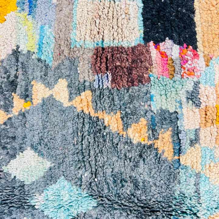 Vintage Moroccan Berber wool rug with colorful geometric tribal patterns in beige, grey, yellow and blue, handmade in Morocco, 256x165 cm