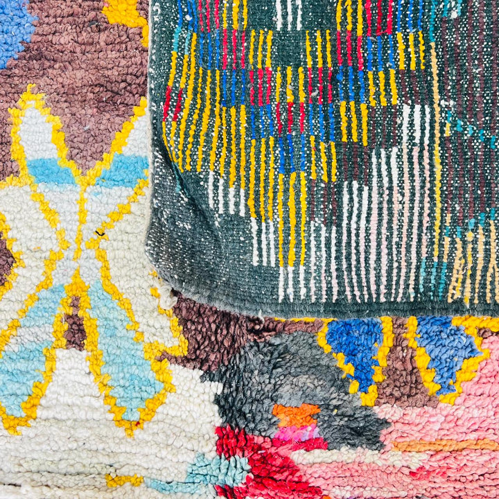 Vintage Moroccan Berber wool rug with colorful geometric tribal patterns in beige, grey, yellow and blue, handmade in Morocco, 256x165 cm