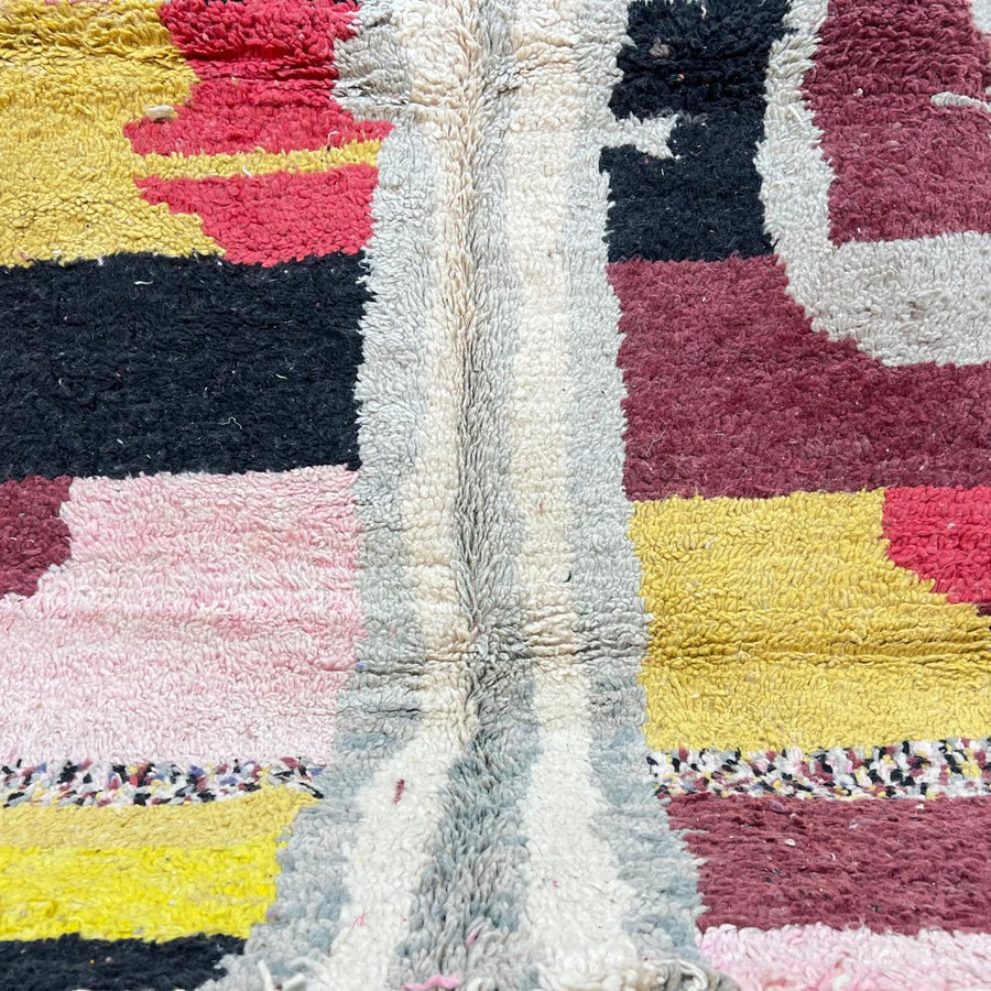 Vintage Moroccan wool rug with colorful abstract Berber pattern in mustard, pink, burgundy and ivory tones, handwoven in Morocco