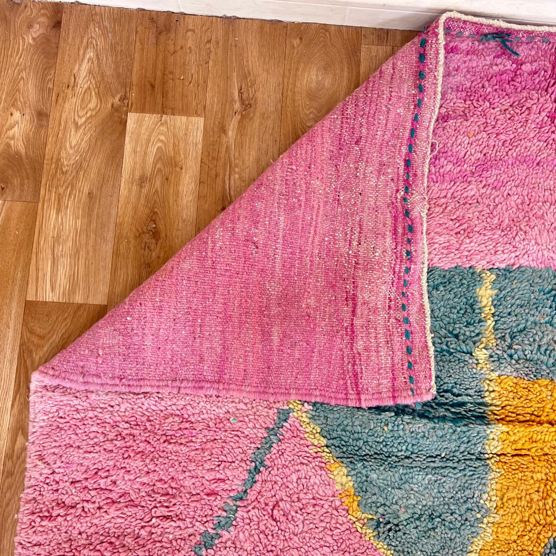 vintage pink moroccan abstract wool rug with geometric design