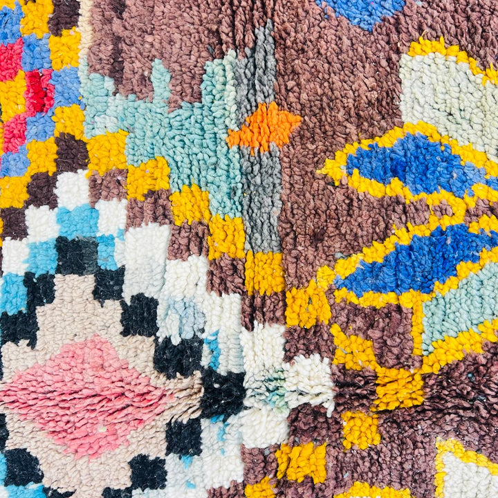 Vintage Moroccan Berber wool rug with colorful geometric tribal patterns in beige, grey, yellow and blue, handmade in Morocco, 256x165 cm