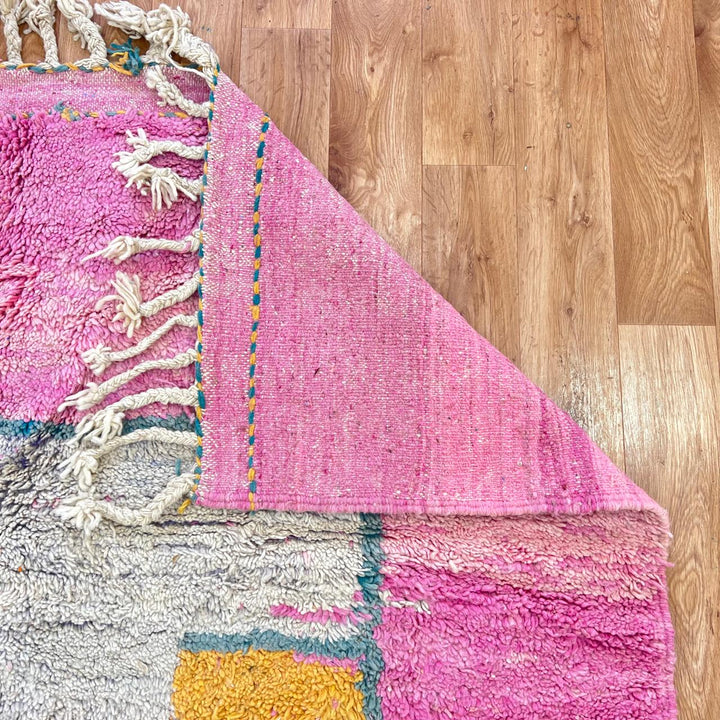 vintage pink moroccan abstract wool rug with geometric design