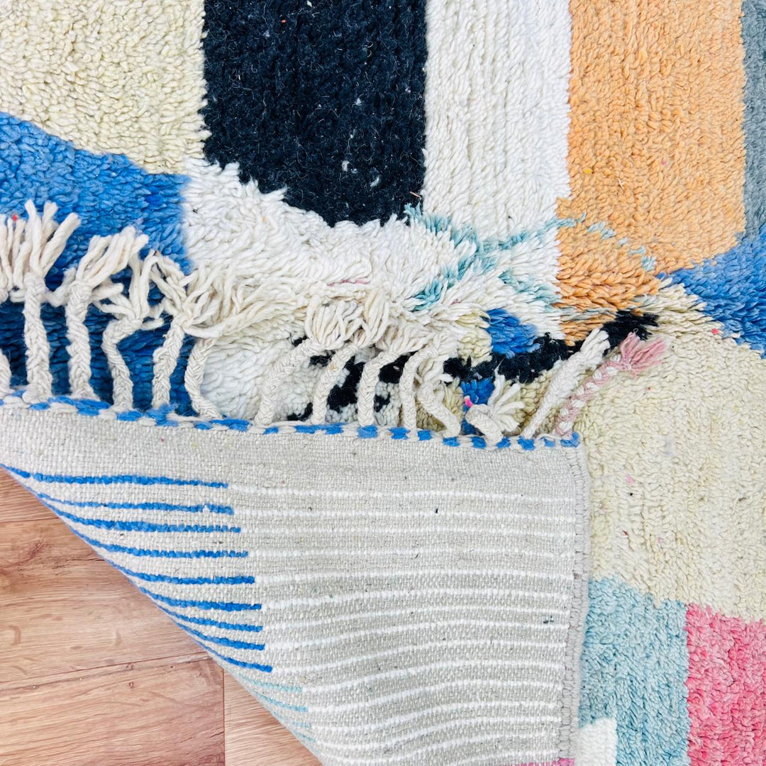 Vintage Moroccan Berber wool rug with pastel geometric color-block design in pink, blue, green and yellow, handmade in Morocco, 225x160 cm
