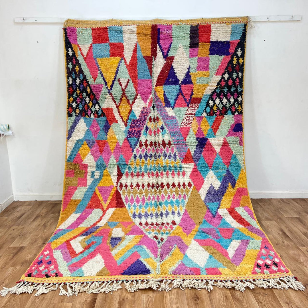 Vintage Moroccan wool rug with colorful diamond Berber pattern in pink, turquoise, mustard and ivory, handwoven in Morocco