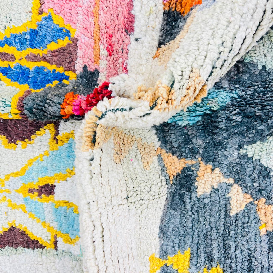 Vintage Moroccan Berber wool rug with colorful geometric tribal patterns in beige, grey, yellow and blue, handmade in Morocco, 256x165 cm