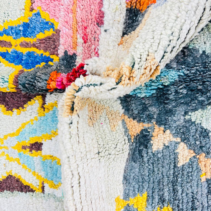 Vintage Moroccan Berber wool rug with colorful geometric tribal patterns in beige, grey, yellow and blue, handmade in Morocco, 256x165 cm